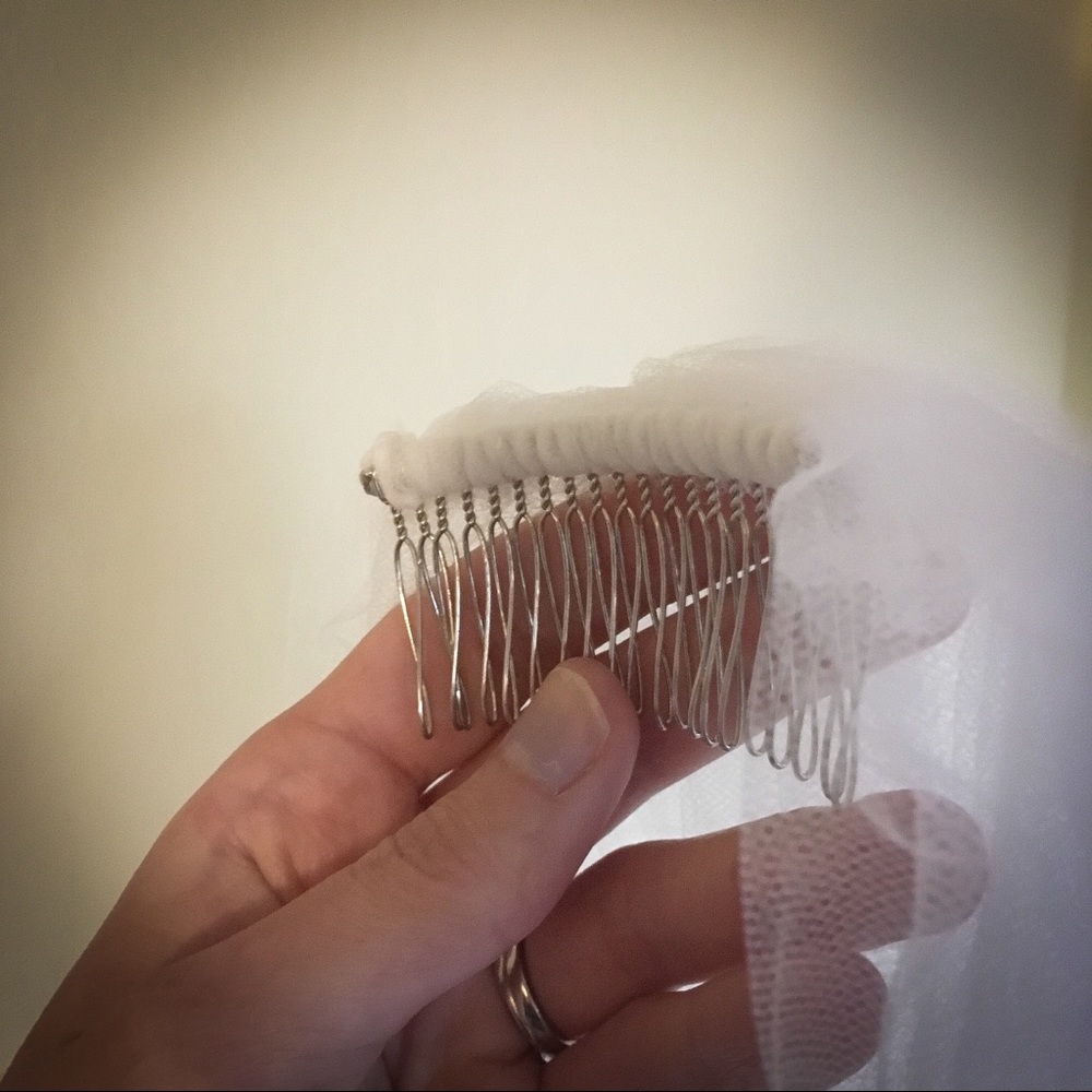 Long white chapel length bridal veil.